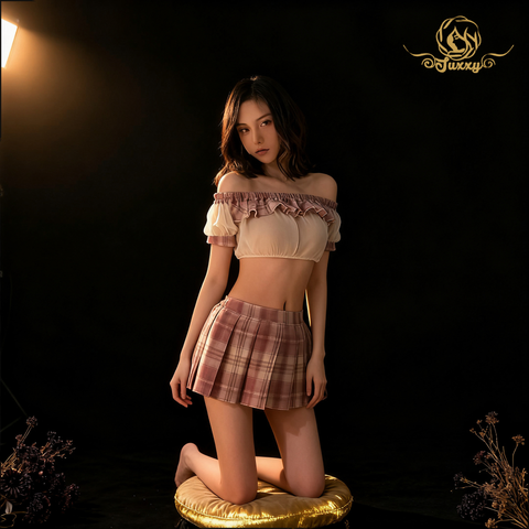 The top features a mesh sheer design with lace trim, paired with a plaid pleated skirt